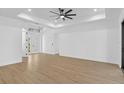 Bright, spacious living room with hardwood floors, recessed lighting, and a double-door entryway at 1826 Narrington Ave, North Port, FL 34288