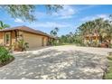 Wide driveway and multiple-car garage offering ample parking and storage space at 2700 Sheboygan Ave, North Port, FL 34286