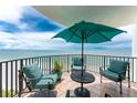 Relaxing balcony with comfortable seating and ocean views at 2792 N Beach Rd # 301, Englewood, FL 34223