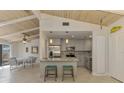 Modern kitchen boasts stainless steel appliances, breakfast bar, and open floor plan at 2980 N Beach Rd # Gv16, Englewood, FL 34223
