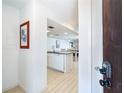 Inviting home interior showcasing a modern kitchen with sleek countertops and white cabinetry at 301 S Gulf Blvd # 419, Placida, FL 33946