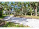 The home is situated on a large lot with a long driveway made of crushed shells at 425 Laurel W Rd, Nokomis, FL 34275