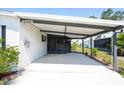Spacious covered carport area with ample parking and outdoor living space at 6168 Partridge Ave, Englewood, FL 34224