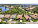 Expansive aerial view of a residential community with waterfront access and meticulously maintained landscapes at 13217 Scrub Jay Ct, Port Charlotte, FL 33953