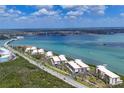 Scenic aerial view of waterfront condos by the bay, showcasing the coastal lifestyle at 1701 Beach Rd # 208, Englewood, FL 34223