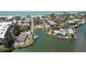 Aerial view highlighting the canal-front location, docks, and community pool at 2769 N Beach Rd # 105, Englewood, FL 34223