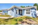 Inviting home exterior with a cozy front bench and neat landscaping details at 2821 Embassy Rd, North Port, FL 34291