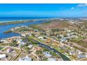 Waterfront home boasts direct gulf access and views of Lemon Bay, nestled in a vibrant coastal community at 30 Buccaneer Bnd, Placida, FL 33946
