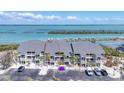 Beautiful exterior of condo building offering beachfront access and parking at 6030 Boca Grande Cswy # B21, Boca Grande, FL 33921