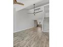 Spacious living room boasts vaulted ceilings and light wood-look flooring for a modern, airy feel at 6030 Boca Grande Cswy # B21, Boca Grande, FL 33921