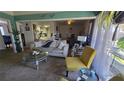 Bright living room with vaulted ceilings, comfortable seating, and an open floor plan at 6540 Coliseum Blvd, Port Charlotte, FL 33981