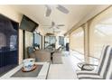 A covered outdoor lanai provides an ideal space for dining and recreation with views of the pool at 23347 Lehigh Ave, Port Charlotte, FL 33954