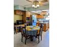 Enjoy casual meals in this inviting kitchen area, featuring ample cabinet space and plenty of natural light at 2650 Colonade Ln, North Port, FL 34286