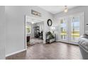 Inviting home foyer showcases tile flooring, neutral paint, and a view into the adjacent office space at 27 Sportsman Cir, Rotonda West, FL 33947