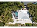 Stunning aerial view of a modern home with a private pool and lush tropical landscaping at 4065 N Beach Rd # A, Englewood, FL 34223