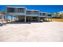Exterior view of a coastal home featuring ground-level parking and beach access at 5030 N Beach Rd # 1, Englewood, FL 34223