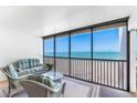 Enjoy ocean views from the covered, screened in lanai with comfortable seating at 5700 Gulf Shores Dr # A312, Boca Grande, FL 33921