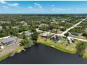 Expansive aerial view of homes in a lakeside community with mature trees and well-maintained streets at 6305 Shalimar St, Port Charlotte, FL 33981