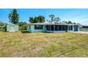 This house has a spacious backyard with a storage shed, offering great outdoor space and storage solutions at 842 E 6Th St, Englewood, FL 34223