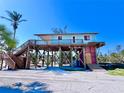Elevated beach house with a large deck and easy beach access at 8472 Grand Ave, Placida, FL 33946