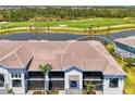 Gorgeous waterfront home overlooking a lush green golf course, and mature landscaping at 12470 Wellen Golf St # 208, Venice, FL 34293