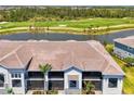 Gorgeous waterfront home overlooking a lush green golf course, and mature landscaping at 12470 Wellen Golf St # 208, Venice, FL 34293