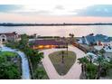 Beautiful aerial view of waterfront homes featuring a beautiful backyard and circular driveways at 1275 Bayshore Dr, Englewood, FL 34223