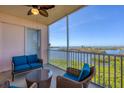 Relaxing screened-in balcony with comfortable seating and panoramic views of the bay at 13113 Gasparilla Rd # A503, Placida, FL 33946