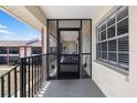 Screened-in porch with decorative elements and views of the exterior grounds at 1531 Placida Rd # 201, Englewood, FL 34223