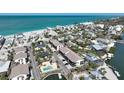 Coastal community featuring a pool, boat dock, and condos near a sandy beach and ocean at 2769 N Beach Rd # 205, Englewood, FL 34223