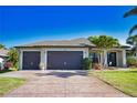 Beautiful home with a large driveway, two-car garage and well-maintained landscaping at 35 Medalist Rd, Rotonda West, FL 33947