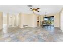 Open-concept living and dining area features tiled floors and ample natural light at 39 Bunker Pl, Rotonda West, FL 33947