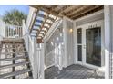 Charming entrance with stairs leading to a welcoming door with visible unit number at 7470 Palm Island Dr # 2813, Placida, FL 33946