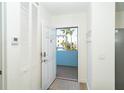 Bright entryway with tile floors and a view of the outdoors through the open front door at 8413 Placida Rd # 205, Placida, FL 33946