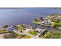 Stunning aerial view of the waterfront neighborhood with beautiful waterways, docks, and lush landscaping at 12445 Krome Ave, Port Charlotte, FL 33981