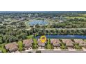 An aerial view of the homes, with water views and meticulously landscaped yards in the neighborhood at 1339 Backspin Dr, Englewood, FL 34223