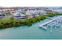 Scenic aerial view of waterfront home, showcasing its prime location and private boat dock access at 16716 Grande Quay Dr, Boca Grande, FL 33921