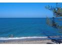 Picturesque beach view featuring clear turquoise water and sandy shore at 2950 N Beach Rd # B324, Englewood, FL 34223