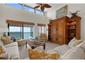 Inviting living room with comfortable seating, ceiling fan, and stunning ocean view at 2950 N Beach Rd # B324, Englewood, FL 34223