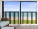 Sliding glass doors show the beautiful ocean view from the lanai at 2950 N Beach Rd # B324, Englewood, FL 34223