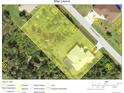 This aerial view shows the property lines, surrounding roads, and nearby structures at 2957 Montgomery Dr, Port Charlotte, FL 33981