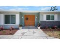 Beautiful front entrance featuring a double-door entry and decorative potted plants at 360 E Wentworth Cir, Englewood, FL 34223