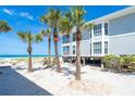 Charming beach house on stilts, surrounded by palm trees and pristine white sand at 7548 Palm Island S Dr # 1724, Placida, FL 33946