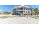 Charming beach house featuring a screened porch offering tranquil views at 7548 Palm Island S Dr # 1724, Placida, FL 33946