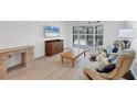Comfortable living room featuring plenty of natural light and cozy seating arrangement at 149 Englewood Isles Pkwy # 603, Englewood, FL 34223