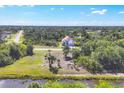Aerial view showcasing the home's proximity to serene waterways and natural landscape at 161 Haddock Dr, Rotonda West, FL 33947