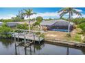 Waterfront home with dock and boat lift for enjoying direct access to the open waters at 18790 Countryman Ave, Port Charlotte, FL 33948