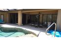 Inviting pool area with covered patio, ideal for outdoor dining and entertaining at 19 Medalist Way, Rotonda West, FL 33947