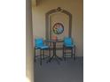 Cozy porch area with seating for two, perfect for enjoying the outdoors at 19 Medalist Way, Rotonda West, FL 33947