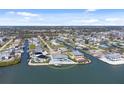 Waterfront living at its finest with a stunning property featuring a private pool and canal access for boating and watersports at 1900 Illinois Ave, Englewood, FL 34224